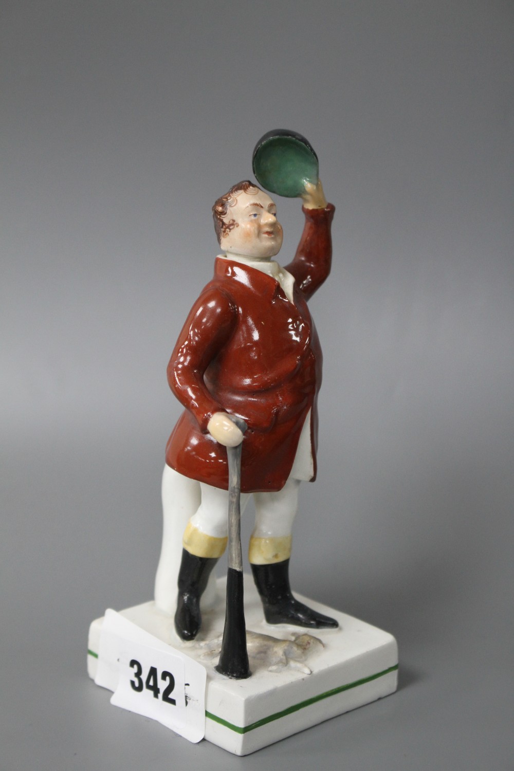 A 19th century Staffordshire figure of a huntsman with stoppered head and square base, height 17cm